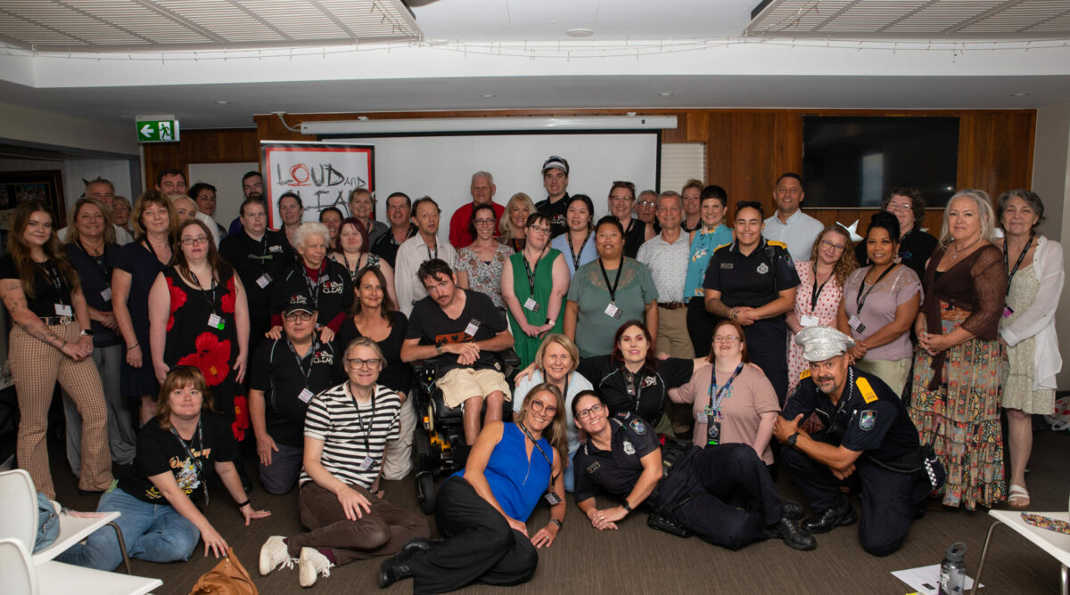 Group of people looking happy with police officers